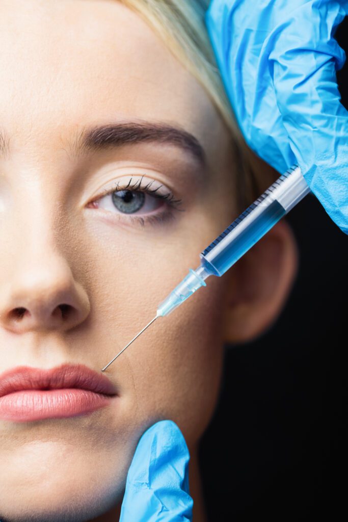 Woman receiving injection on her lips